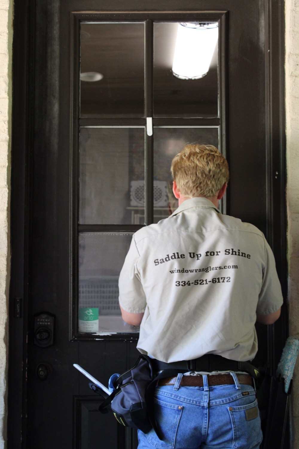 Window Wranglers cleaning windows at an Auburn, AL home — Saddle Up for Shine